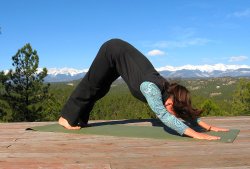 Downward Dog yoga pose, Sangre de Cristo mountain view, Colorad