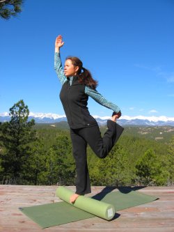Modified Dancer's Pose on a foam roller.
