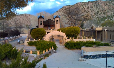 Holiday luminarias line the walls of El Santuario de Chimayo, Santa Fe, NM