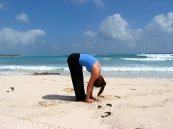 Standing Forward Bend at Playa del Carmen Beach, Mexico