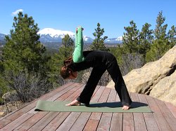 Intense Chest Stretch with arms in Dukha position, West Spanish peak in backgroun