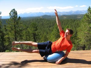 Bosu Ball, side lying extension, modified with one arm up.