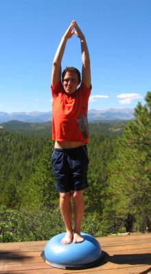 Photo of Basic Standing Pose with Arms Up on the Bosu Ball