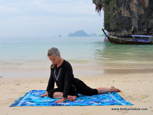 Pigeon Pose on Pranang Beach, Railay, Thailand Pigeon Pose on Pranang Beach, Railay, Thailand