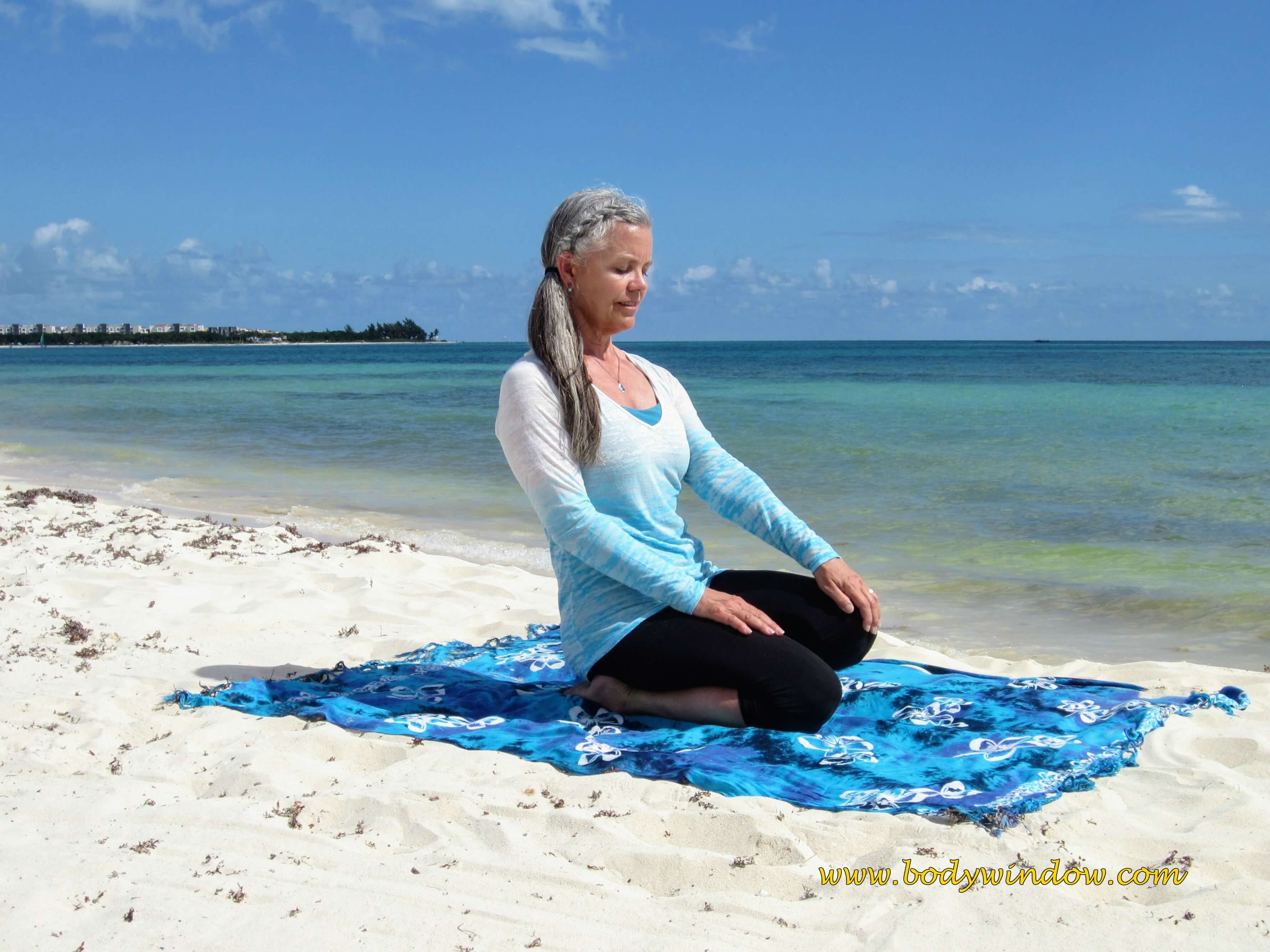 Left Side Ankle Stretch, on a beach in Playa del Carmen, Mexico.