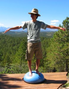 Trying to stand balanced with arms out on the Bosu Balance Trainer