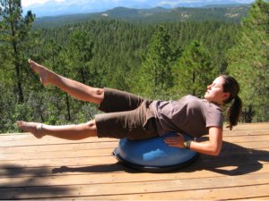 Bosu Ball, back lying extension with one leg up.