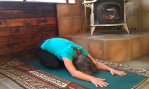 Child's Pose by fireplace.