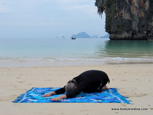 Traditional Child's Pose on Pranang Beach, Railay, Thailand