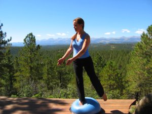 Bosu Balance Trainer, standing on one leg with a twist to right.