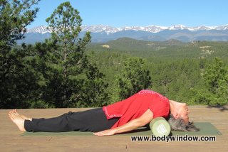 Fish Pose using a foam roller.