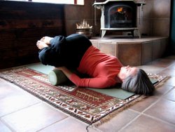 Knees to chest, on foam

roller with knees rolled to the left