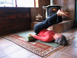 Legs moving toward head on foam roller.