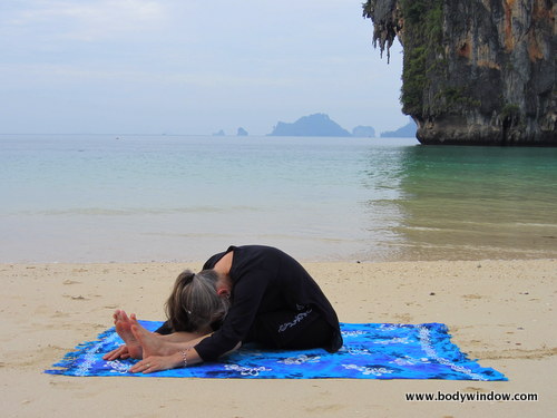 Photo of Elle Bieling doing Seated Forward Bend Pose, Pranang Beach, Railay, Thailand