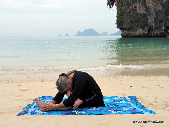 Photo of Elle Bieling doing the Half-Square Pose in Yin Yoga