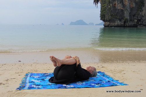 Yin Yoga's Knees Into Chest Pose, Pranang Beach, Railay, Thailand
